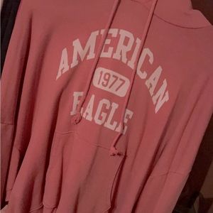 American eagle coral colored hoodie with pockets